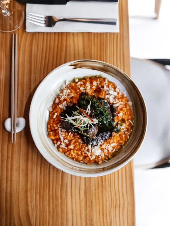 Creamy rocoto rice with pieces of beef tenderloin, seen from above