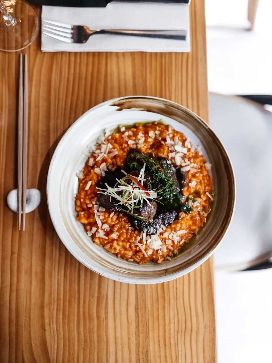 Creamy rocoto rice with pieces of beef tenderloin, seen from above